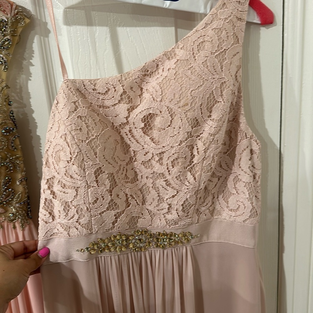 Blush pink. Rhinestone design in stomach. Lace. Asymmetrical. One shoulder